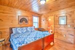 Upper Level Master Suite Features a King Size Bed, Access to Private Covered Deck, and Full Bath
